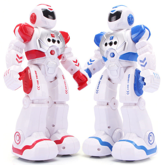 Two toy robots, one red and white, the other blue and white, on a white background.